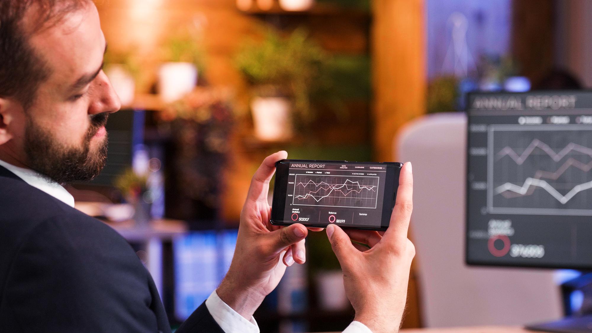 Trader reviewing stock dashboard on tablet